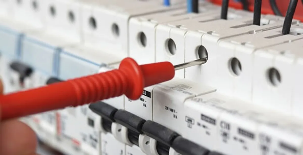 Electrical contractor testing circuit breakers during electrical repair in Tolleson, AZ