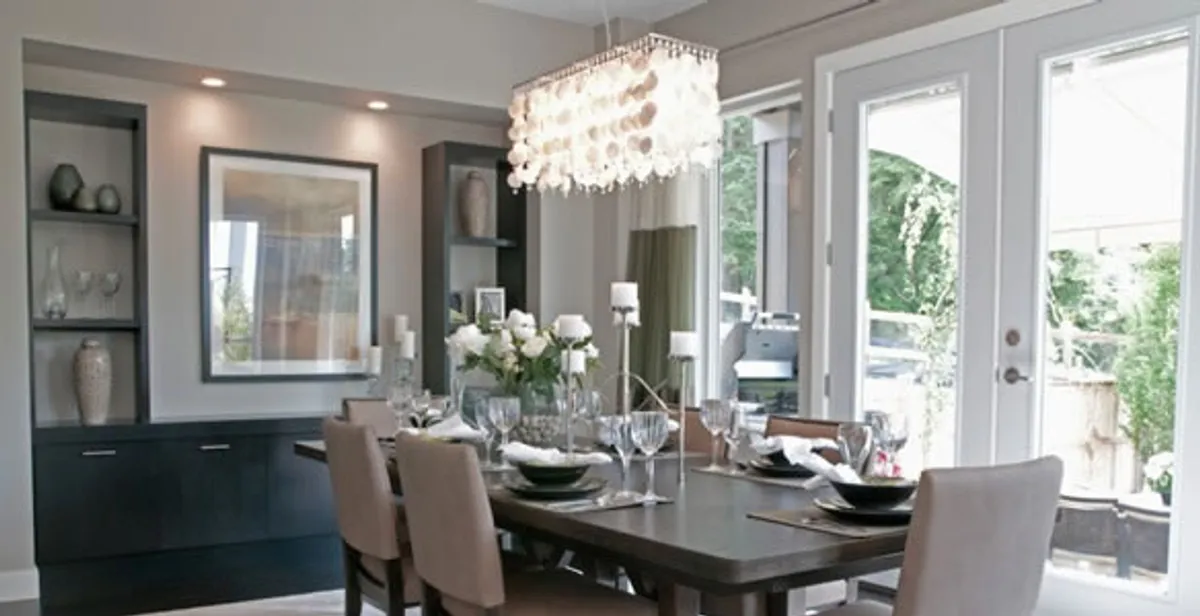 Elegant dining room chandelier installation above table in Glendale, AZ