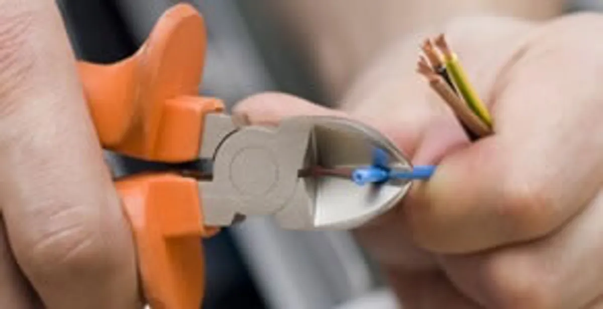 professional electrical services showing precise wire cutting by licensed electricians in Glendale, AZ